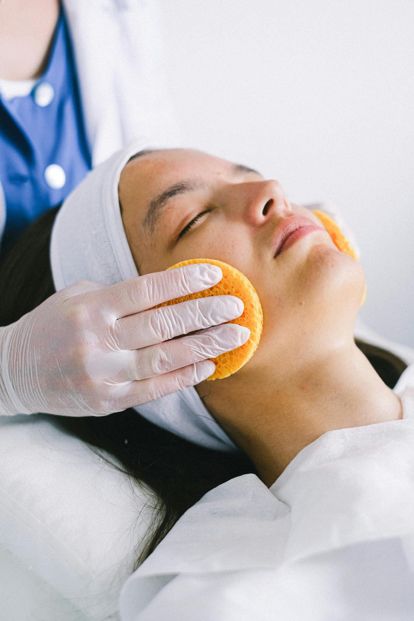 Relaxing facial treatment in a bright treatment room